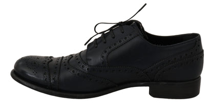 Blue leather wingtip derby shoes with Italian craftsmanship and logo details