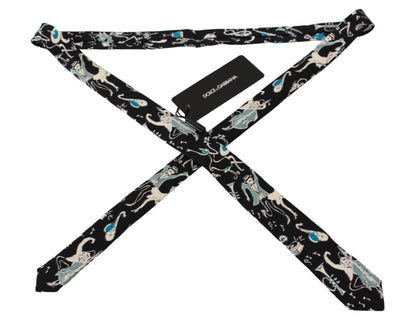 Luxurious Dolce & Gabbana black neck tie with refined music instrument print, the epitome of luxury and style Made in Italy from 100% silk, adding a touch of sophistication and elegance to your formal wear